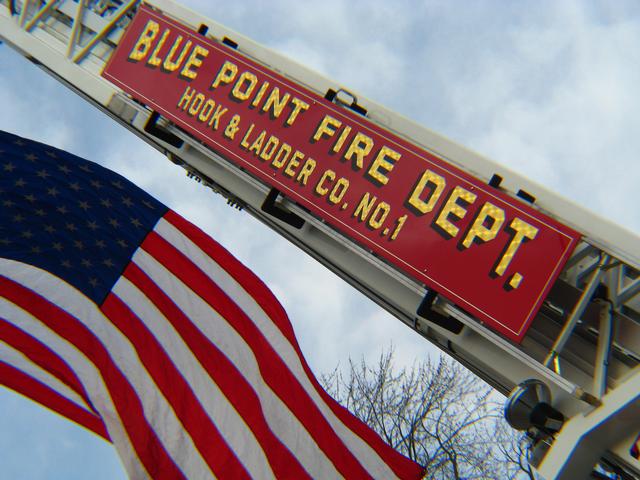 Blue Point 5-2-3 Tower Ladder assists at a parade 